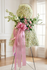 Angel-shaped flower arrangement with fresh white flowers and roses. Standing spray for a funeral service, Soft white and pink colors by Gladys Flowers in Kendall, Miami.