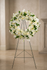 Floral wreath on a stand with beautiful assorted white flowers by Gladys Flowers in Kendall, Miami.