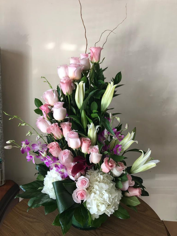 GLW087 - 24 PINK ROSES SPIRAL WITH HYDRANGEAS, ORCHIDS AND LILIES